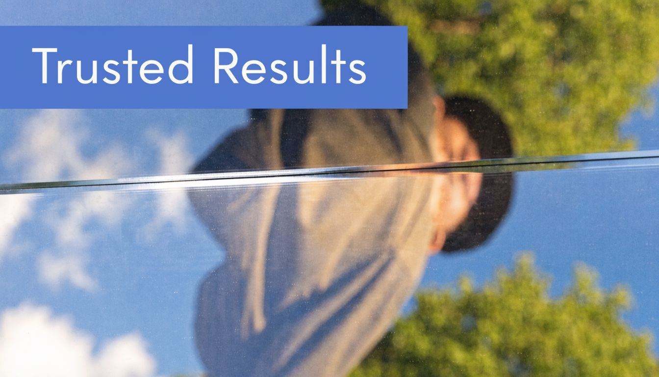 The text Trusted Results is displayed over a reflection of a person wearing a hat and hoodie.