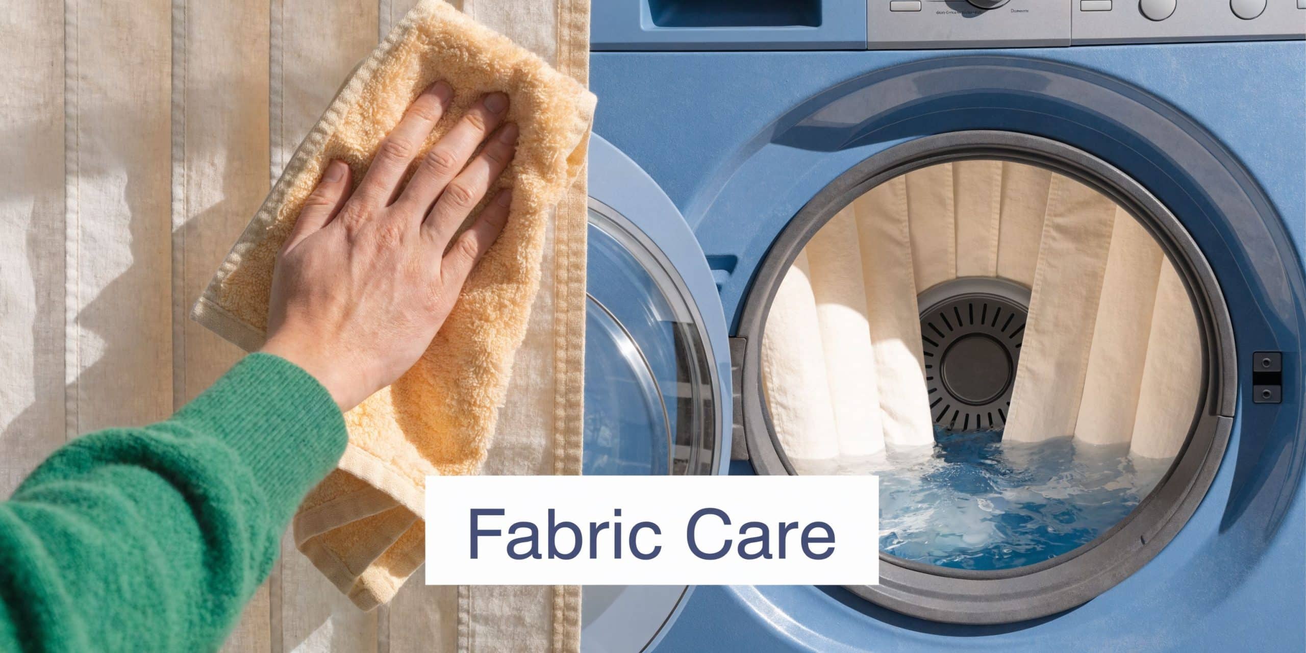 A hand wiping a fabric blind with a cloth next to a blue washing machine filled with water.