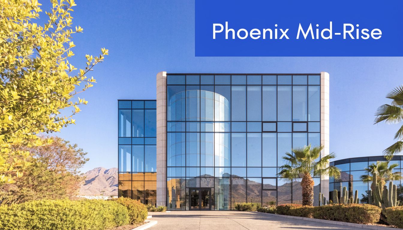 A modern glass mid-rise building under a clear blue sky in the Phoenix desert landscape.