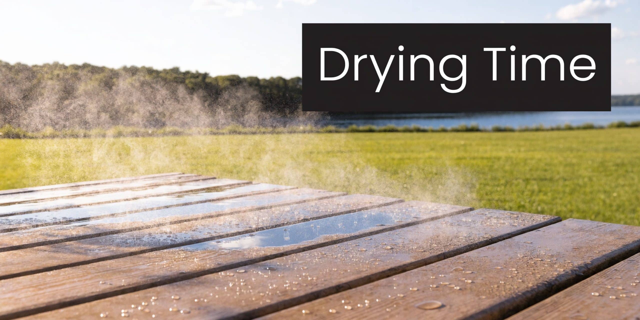 Evaporation rising from a wet wooden deck surface after rain, surrounded by a grassy landscape.