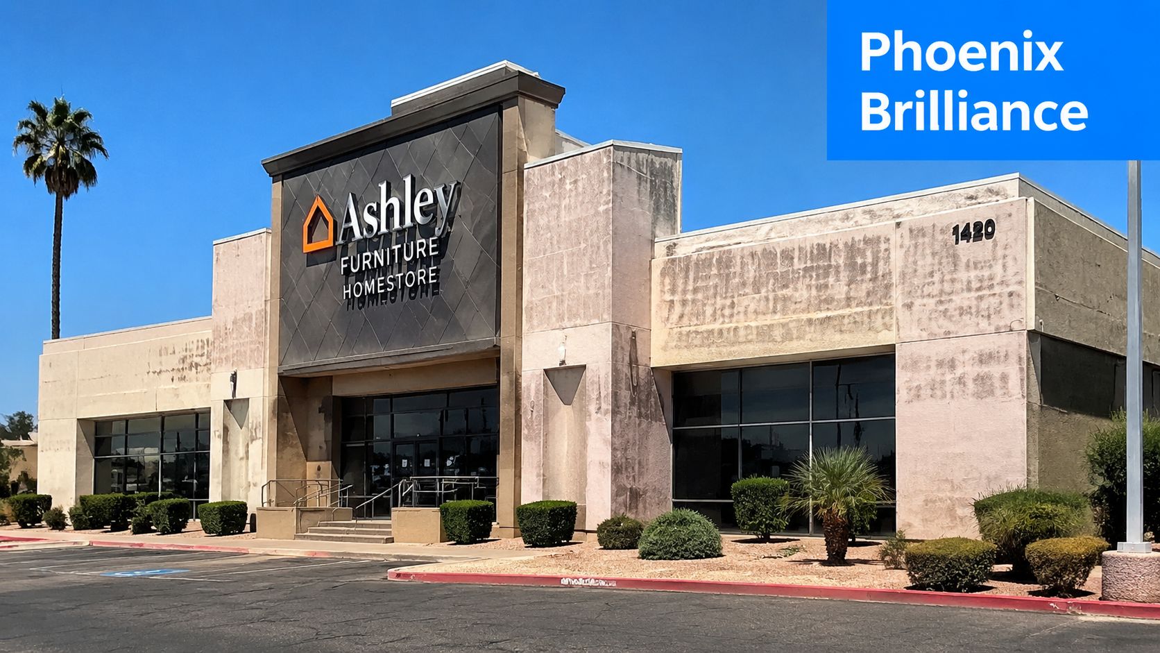 A dirty Ashley Furniture Homestore building facade in need of professional commercial pressure washing services.